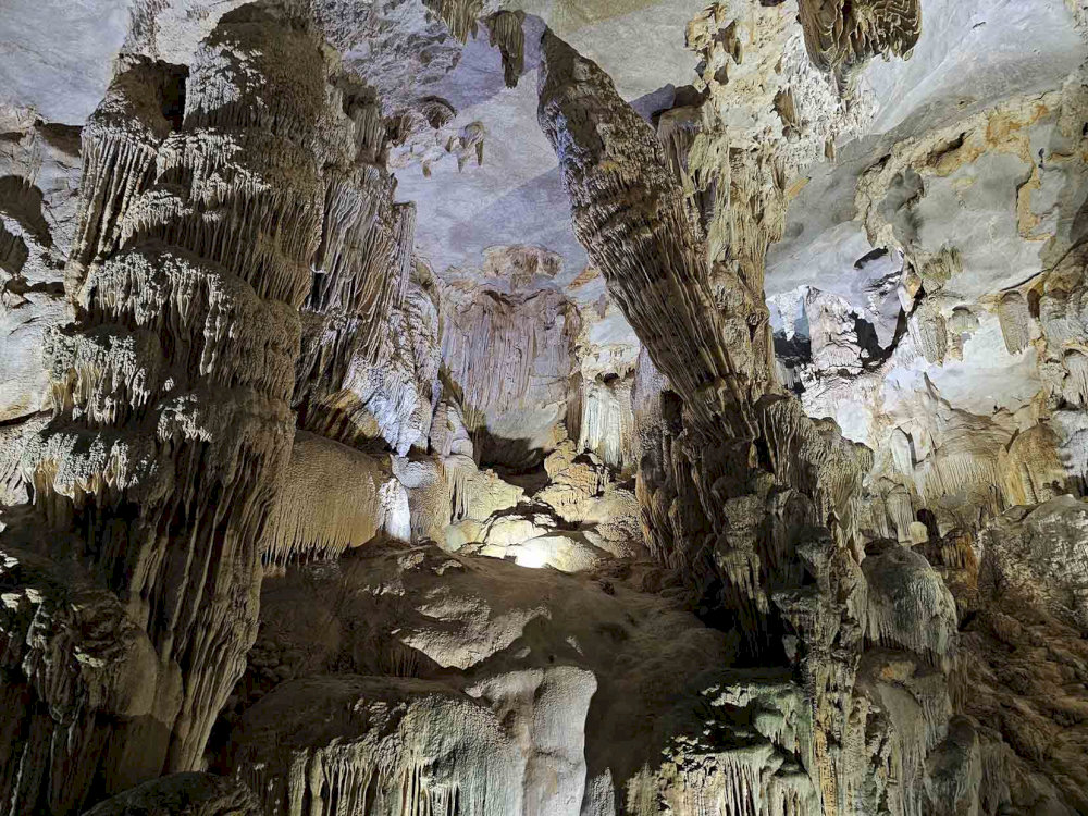 The cave lights cast a beautiful glow on the breathtaking stalactites